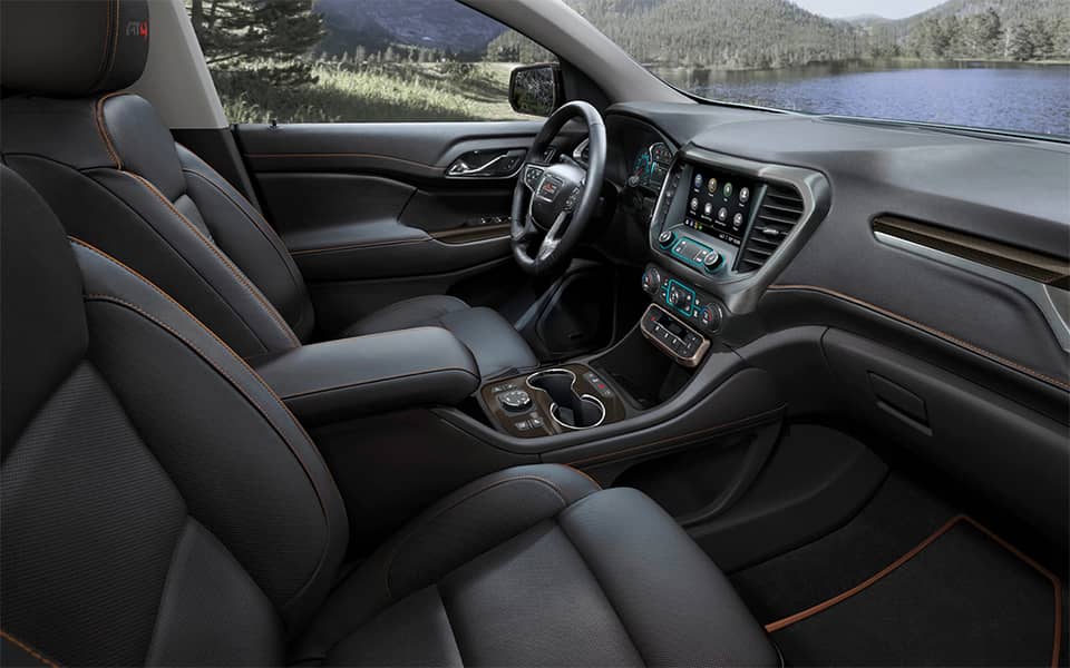 Acadia front interior seats and dashboard from the passenger's window view